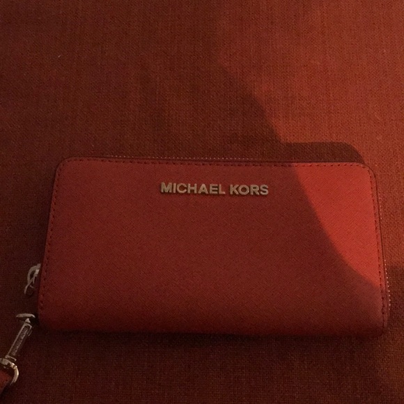 Michael Kors Handbags - Michael Kors Orange wristlet wallet Michael Kors Handbags - Michael Kors Orange wristlet wallet
